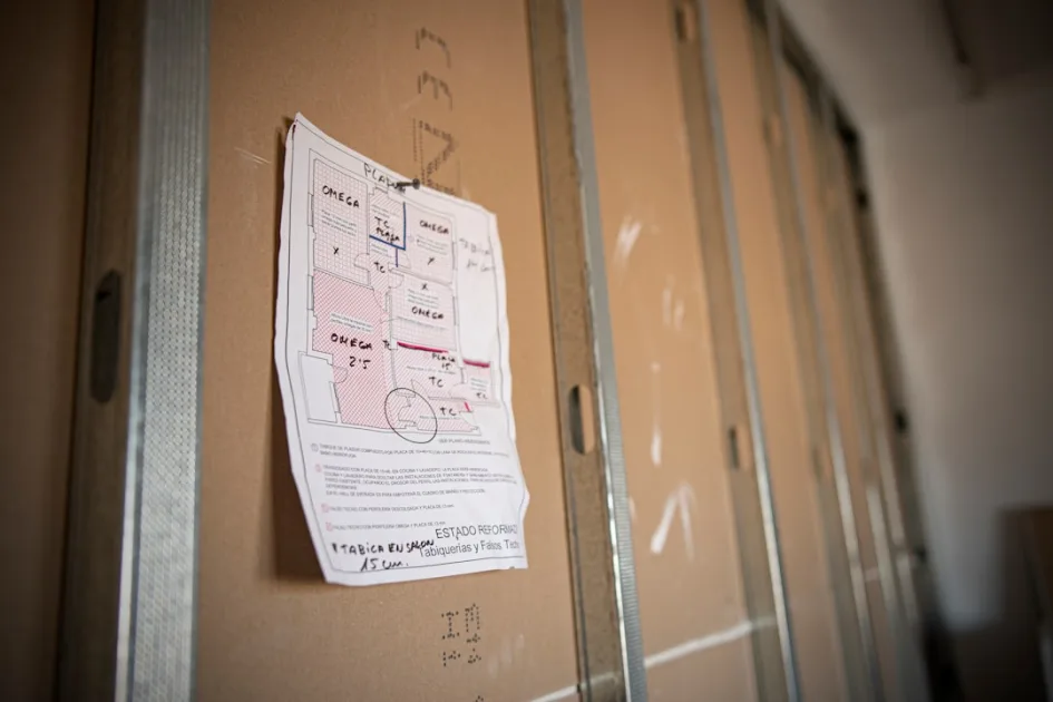 a piece of paper taped to a wall